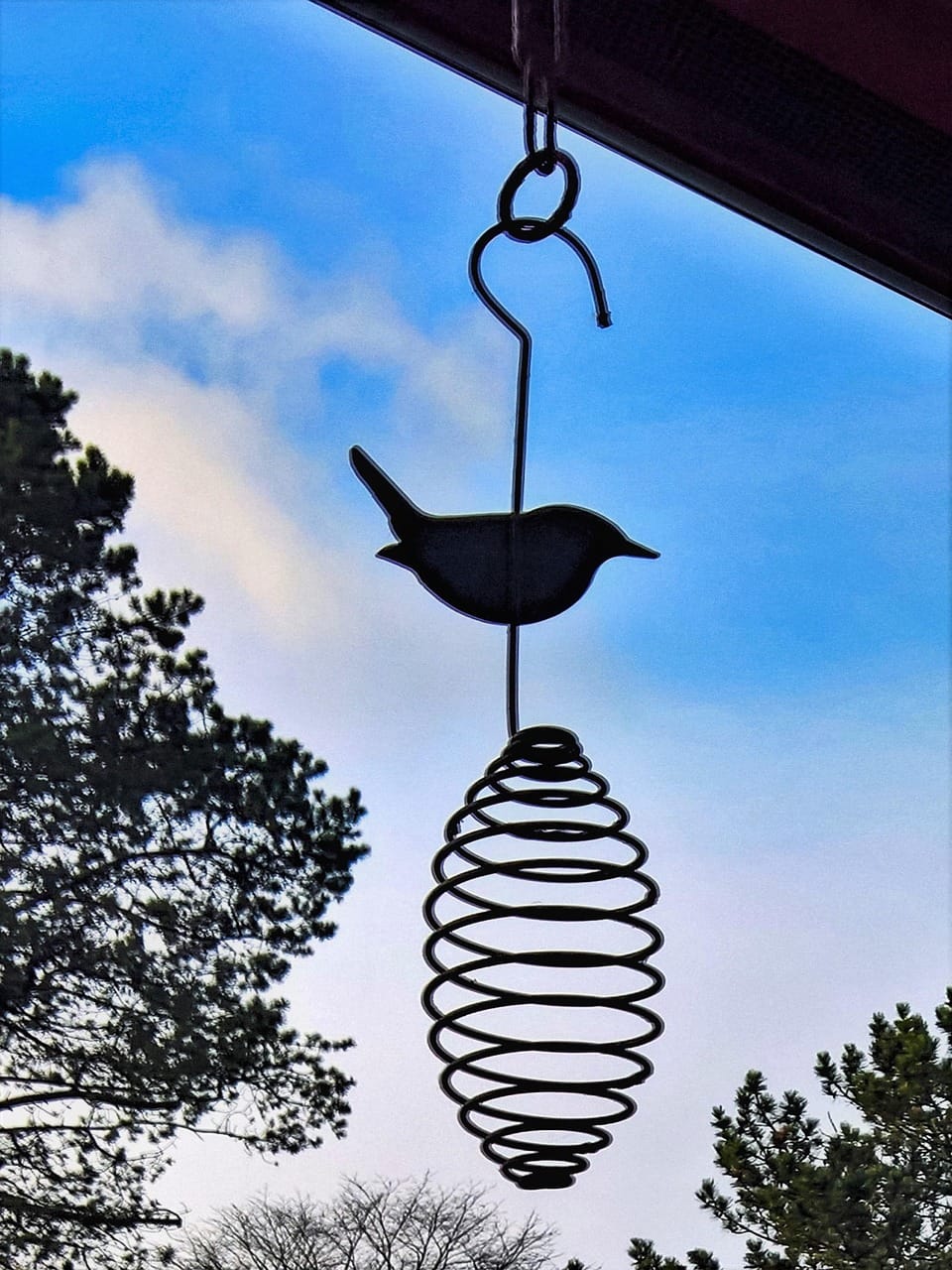 Traditional Korean bird wind chime against sky – place-based music storytelling